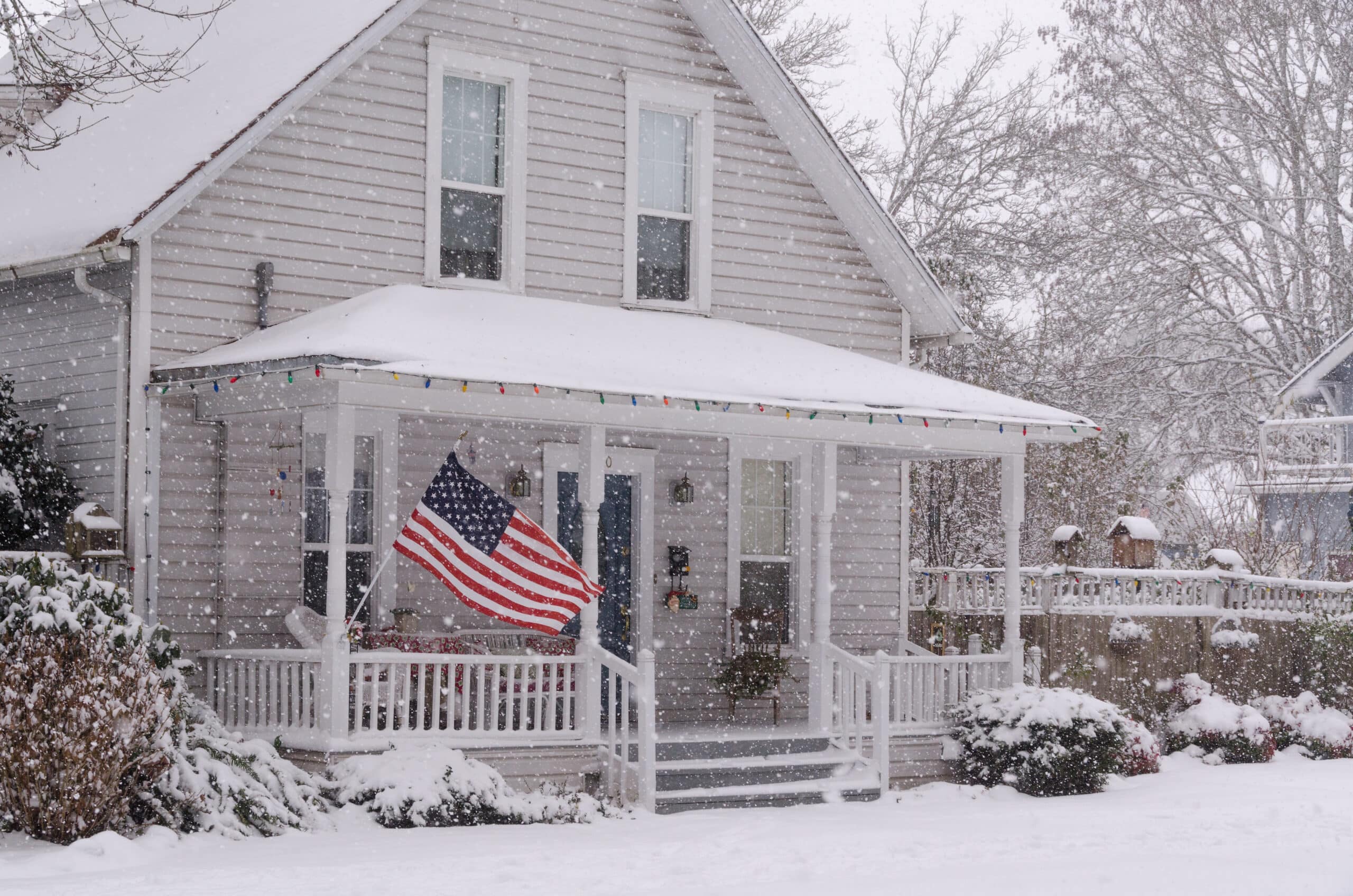 How much does snow weigh on a Middlesex County Massachusetts colonial home - properly cleared roof showing safe snow load management by GAF Master Elite contractor Coastal Windows