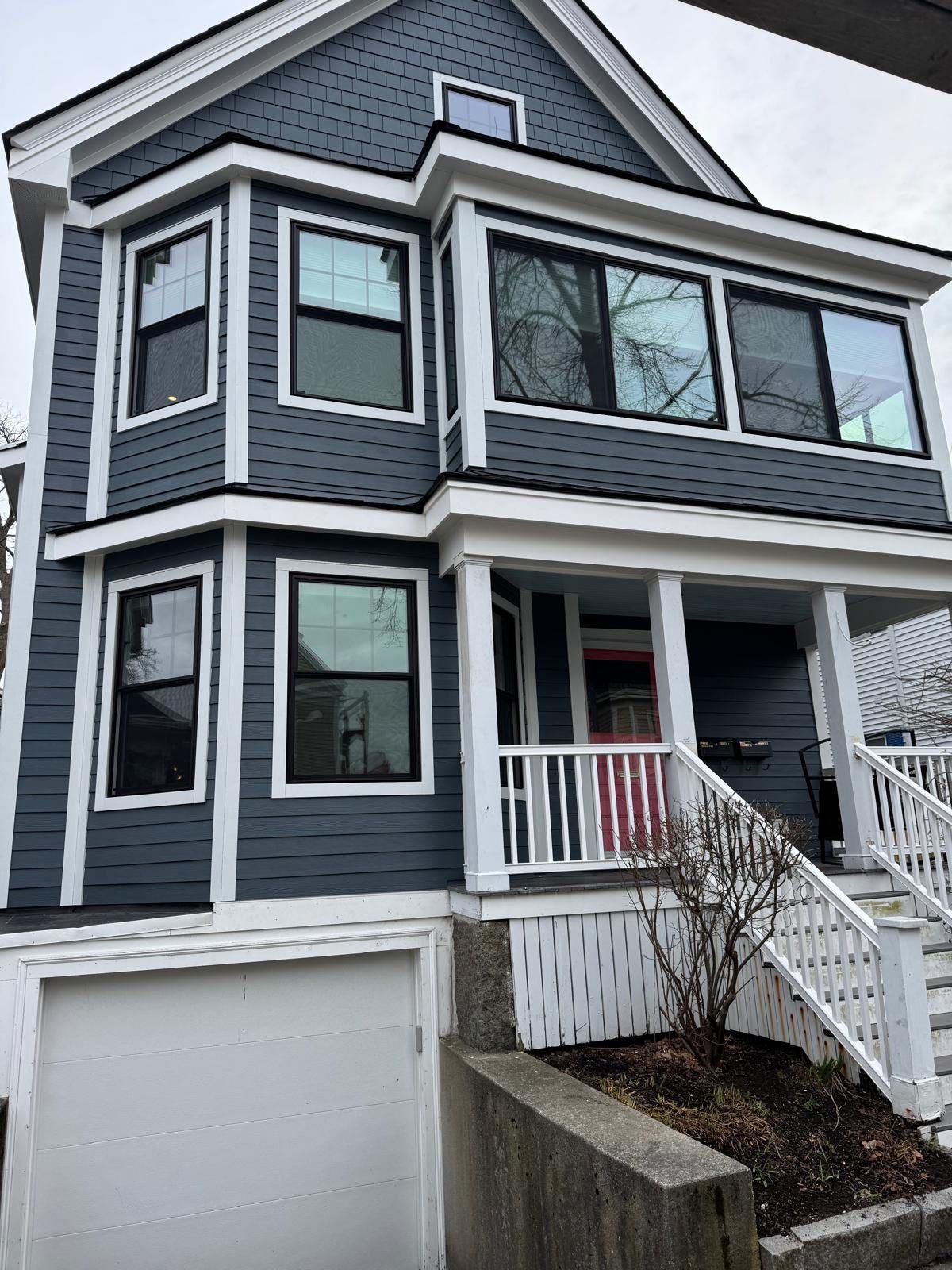 Modern blue house with black windows