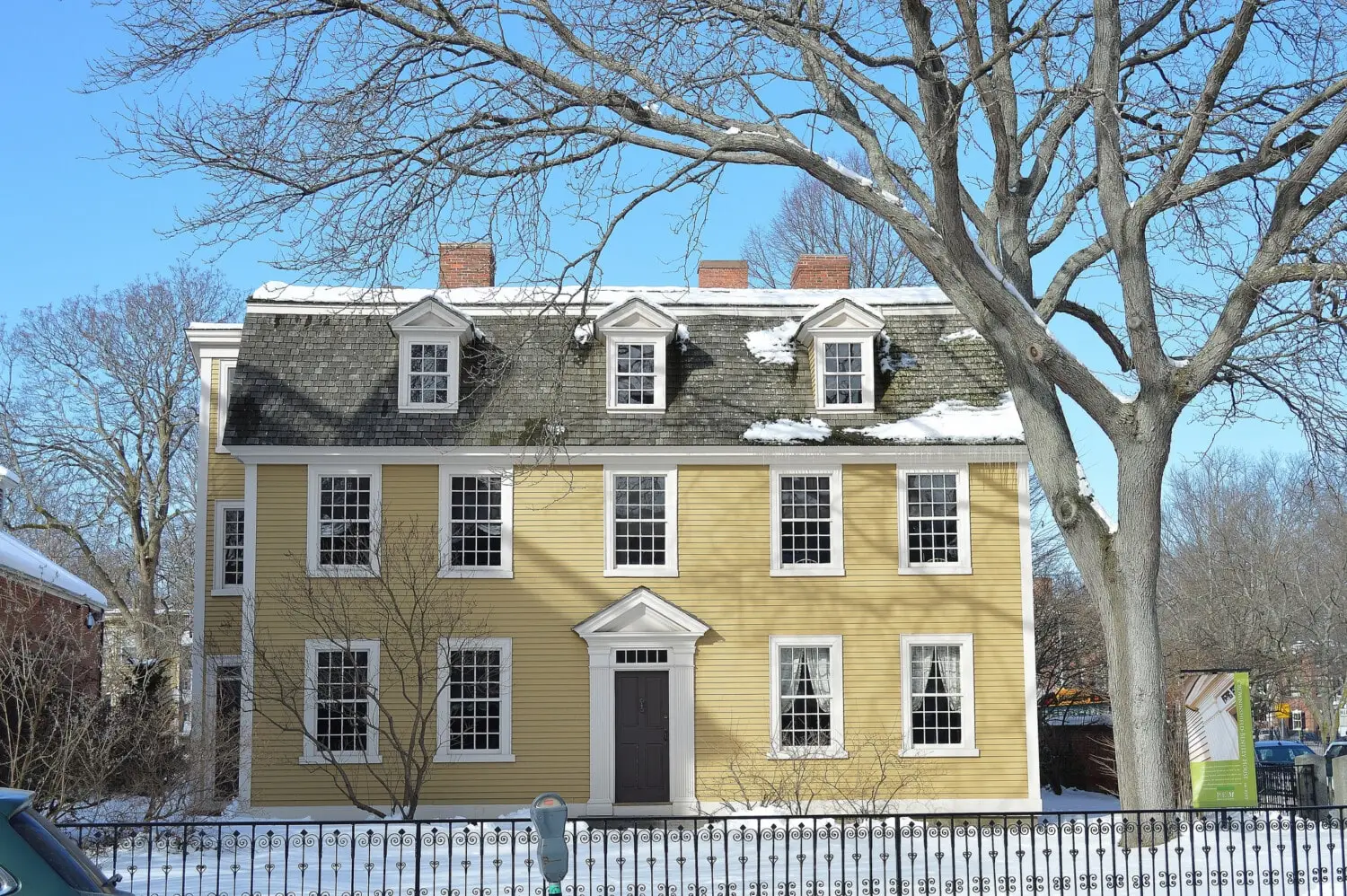 winter home colonial yellow siding
