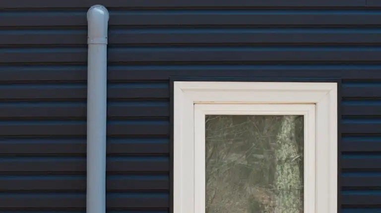 new blue siding and triple plane windows installation from coastal windows on a home