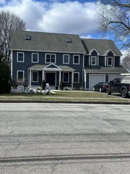 Roofing and siding installation in North Reading MA, Middlesex County, featuring GAF asphalt roofing and James Hardie siding by Coastal Windows & Exteriors