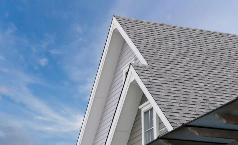 Light-colored asphalt roofing shingles installed in Ashland MA home by Coastal Windows & Exteriors