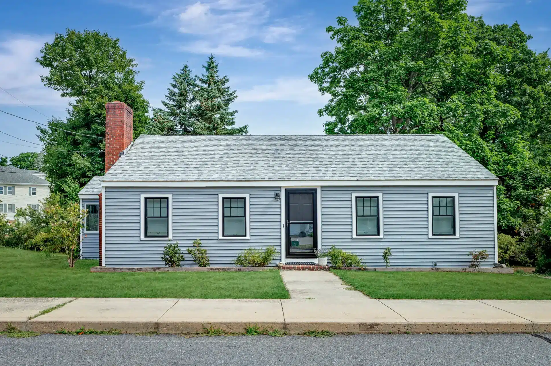 new siding installation in the summer by Coastal Windows & Exteriors, summer exterior home remodeling. 