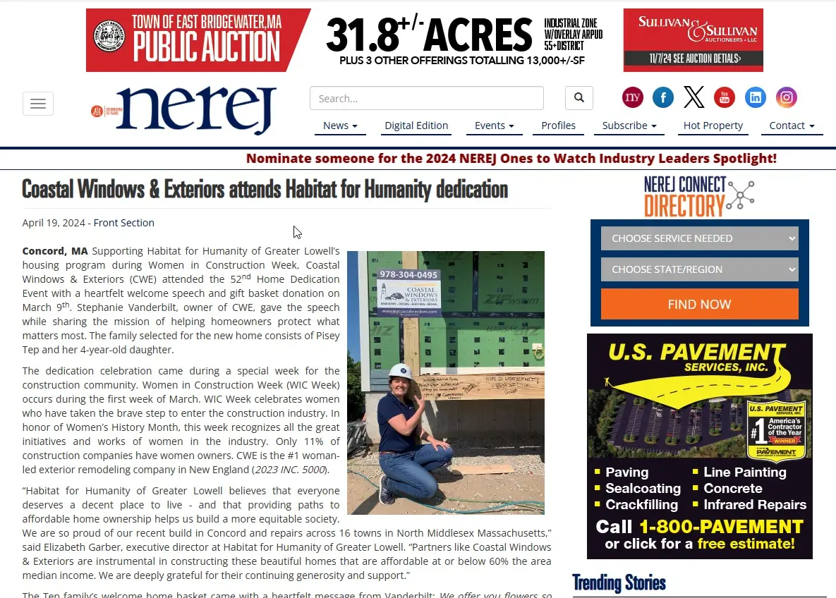 A person in a navy shirt and white hard hat kneels, giving a thumbs up, in front of a partially constructed house with green sheathing. An article about Coastal Windows & Exteriors attending a NEREJ Habitat for Humanity dedication surrounds the image.