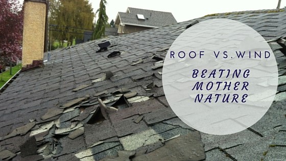 A shingled roof with significant wind damage, showing lifted and missing shingles. Text overlay reads: ROOF VS. WIND—CAN YOUR ROOF WITHSTAND HURRICANE-FORCE WINDS?.