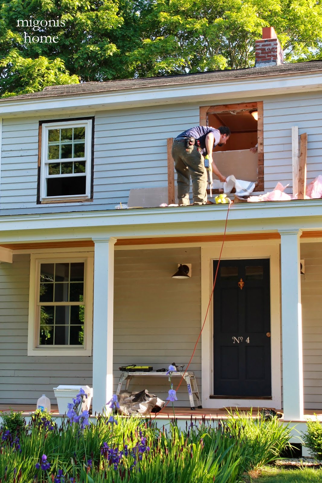 Professional window installer carefully fitting a new home window.