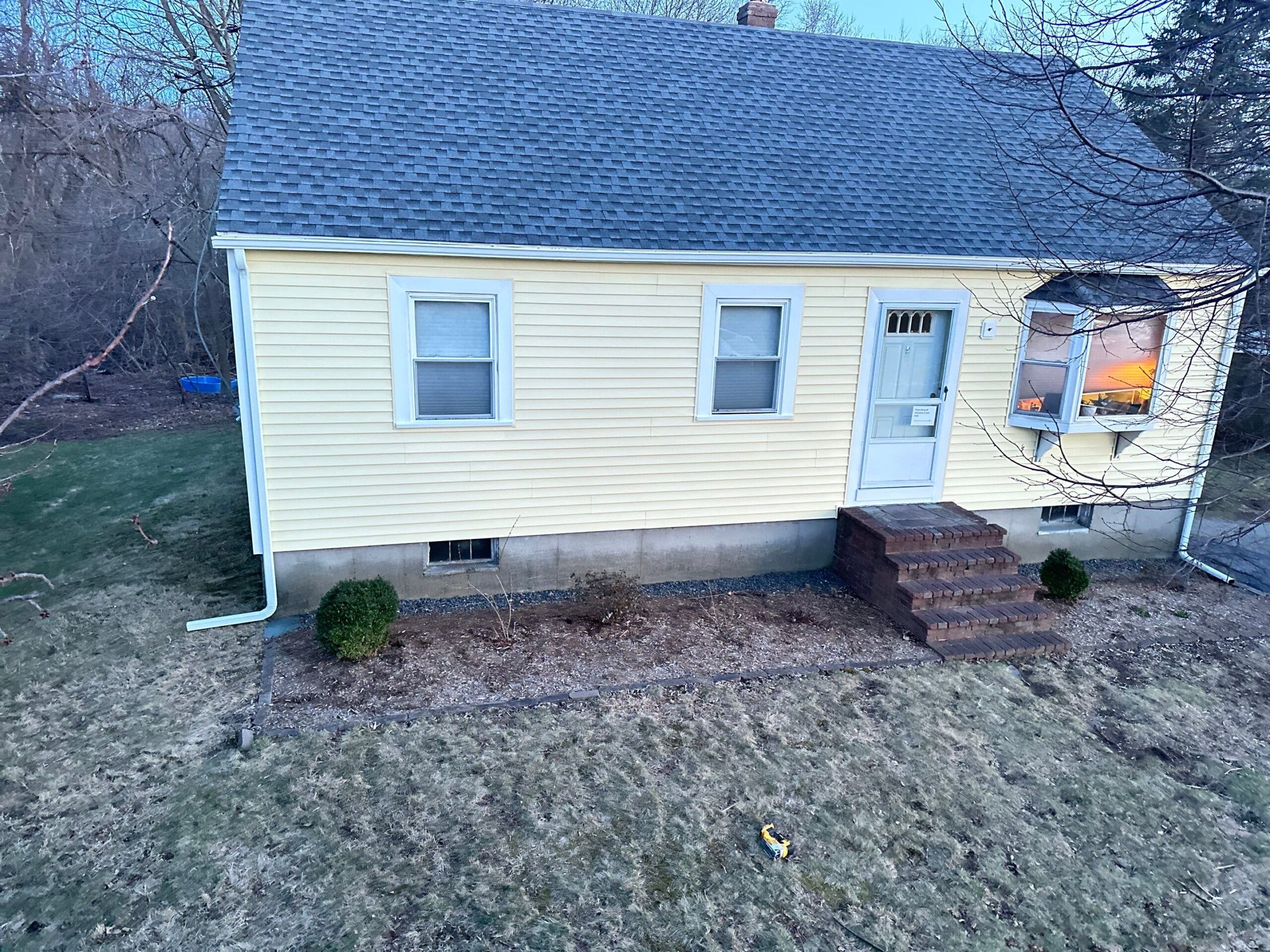Vinyl siding installation by Coastal Windows & Exteriors in Massachusetts, showcasing durable, low-maintenance siding that enhances curb appeal and protects against New England weather.
