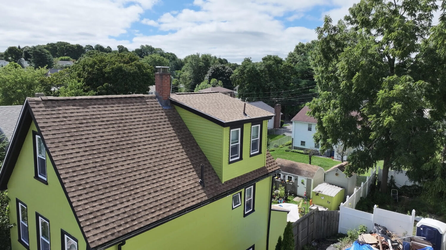 Summer roofing guide identifying the top three threats—storms, attic mold, algae—and solutions to protect New England roofs by Coastal Windows & Exteriors.