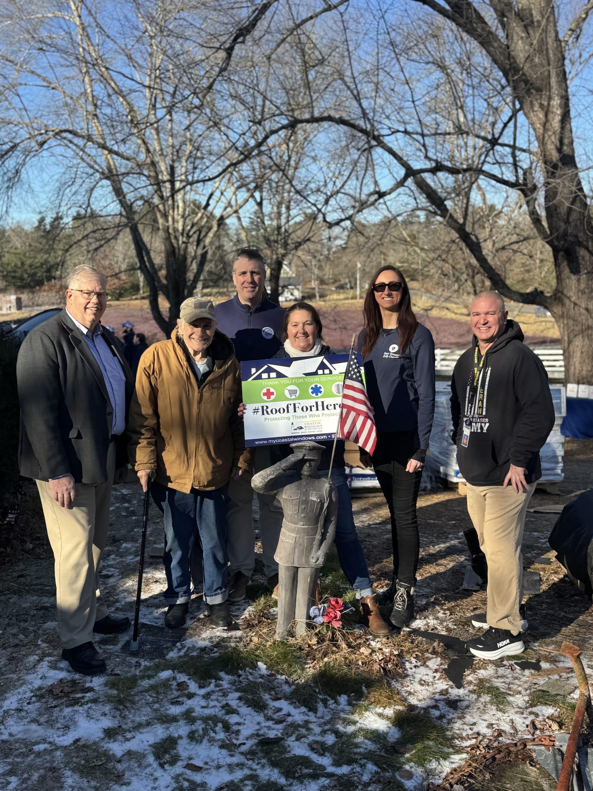 A veteran is honored by Coastal Windows & Exteriors during a Roof For Heroes event in Hopedale MA.