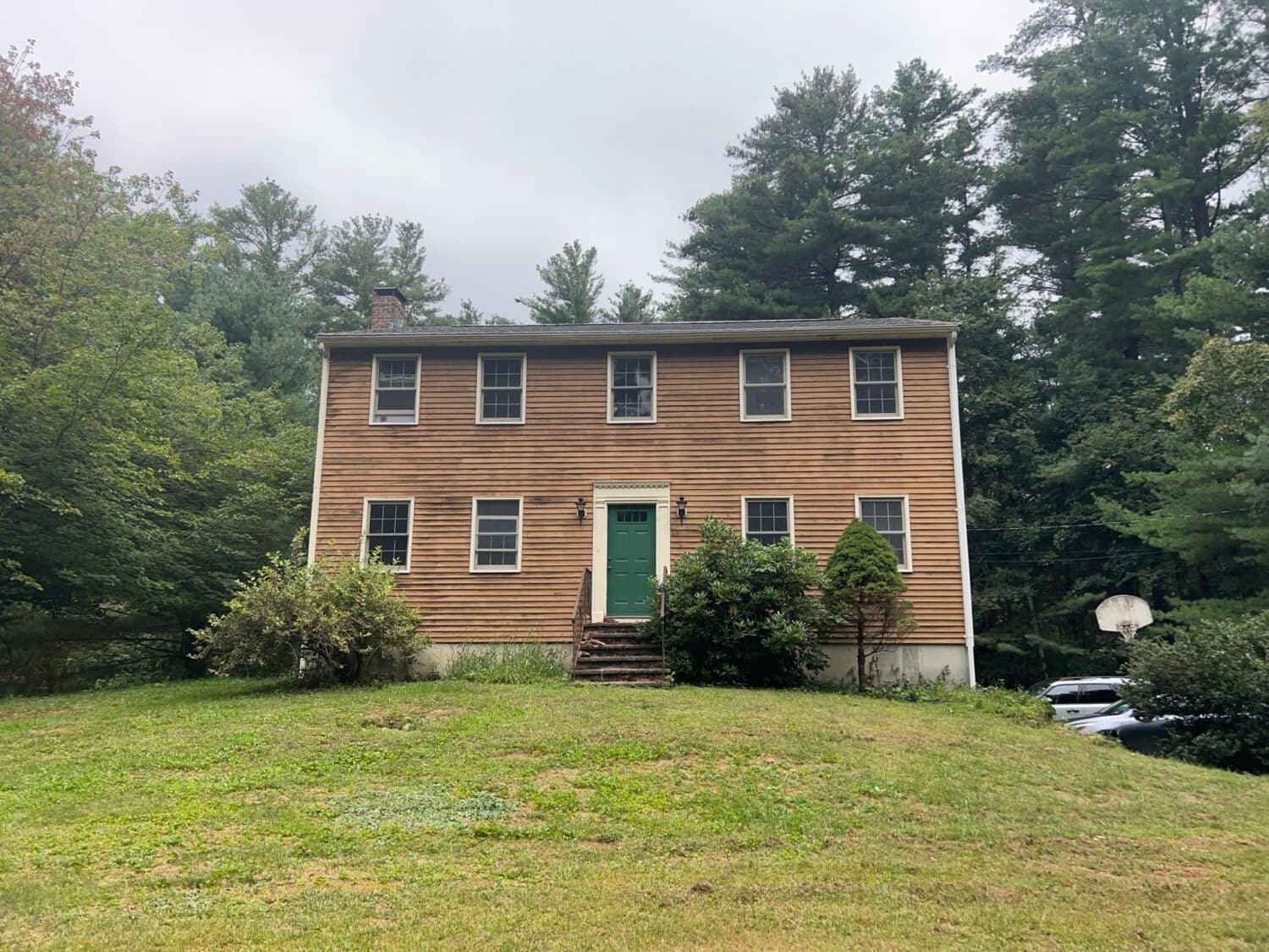 This Weston MA home features vinyl siding that looks like wood for a classic exterior upgrade.