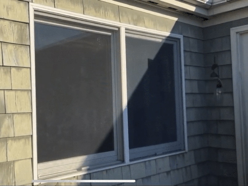 Old drafty windows before replacement during an Exterior remodeling sale in Beverly MA.